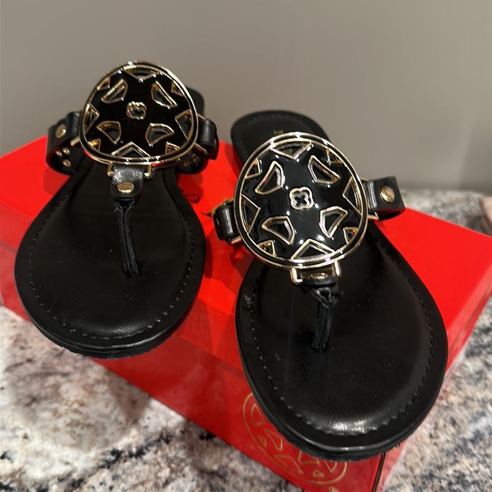 Pierre Dumas black with gold accent medallion flip flops. Size 8 1/2 women’s .